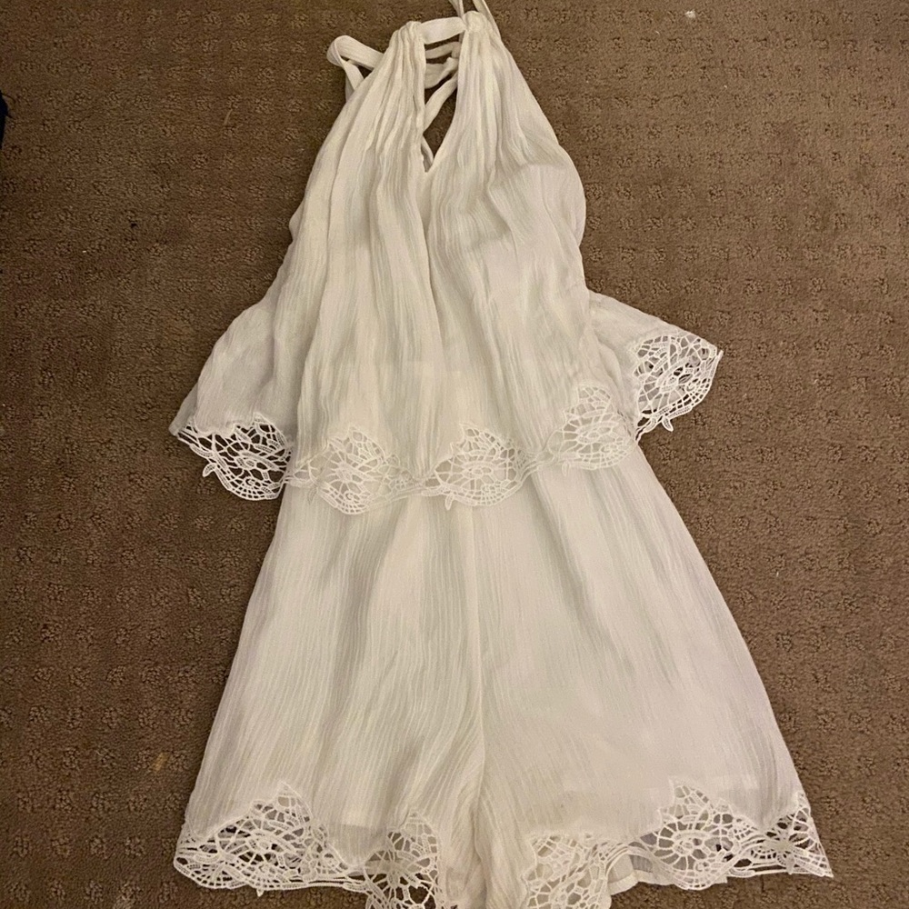 Super cute white romper from the impeccable pig
